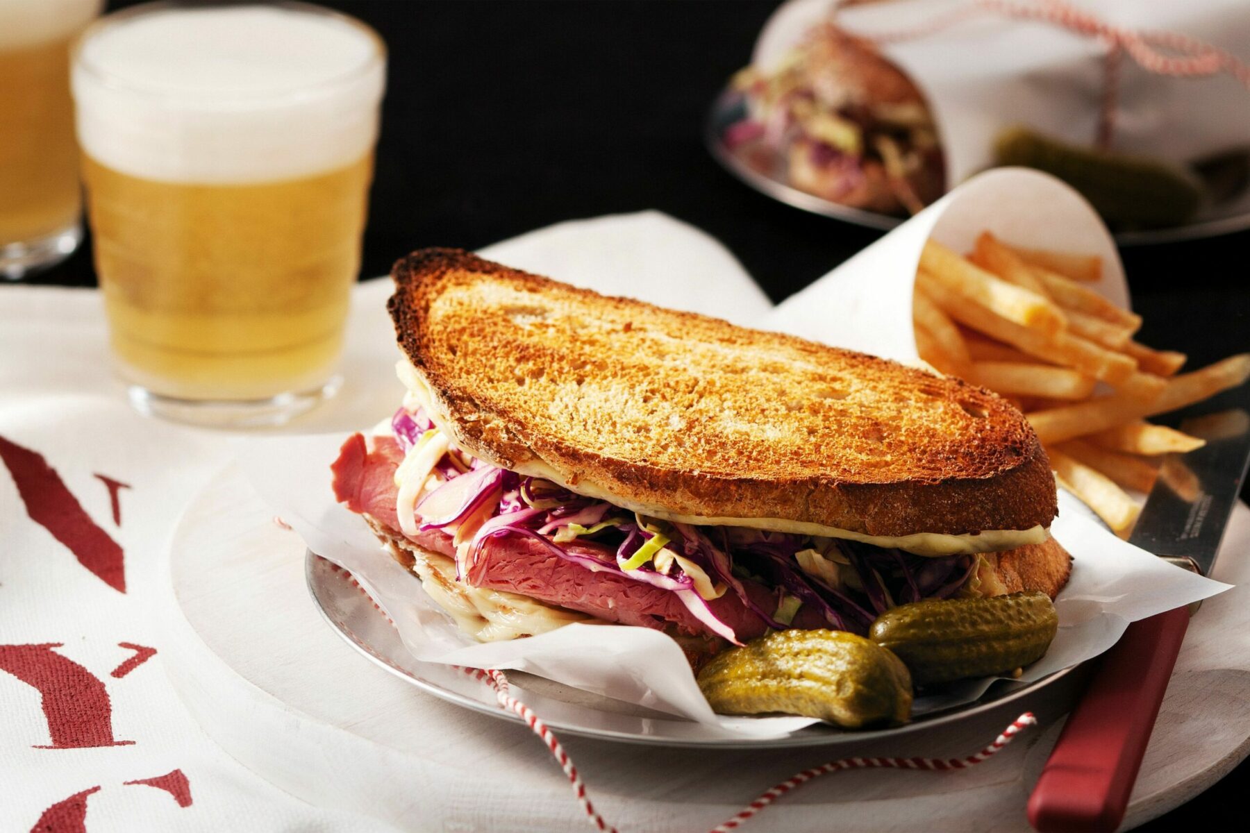 The Brisket Bar SANDWICHErie ANTIBES Reuben Sandwiches With French Fries 88693 1